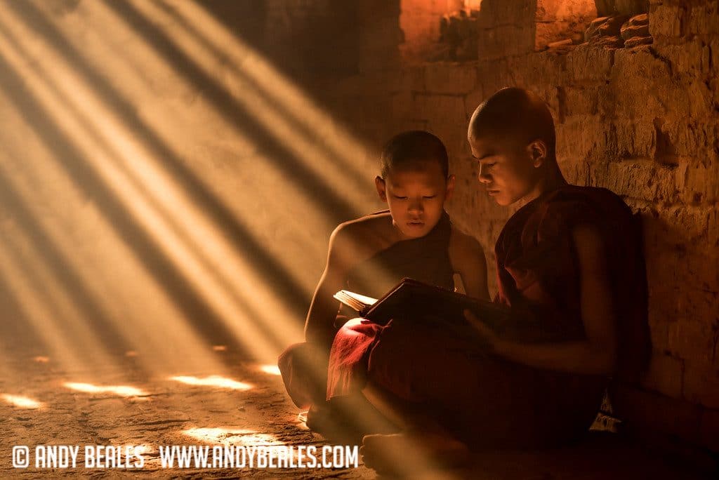 Monks reading inside a Burmese temple of Myanmar