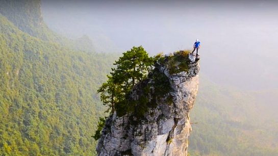 Rock Climber on a Chinese Karst Mountain